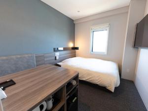 Postel nebo postele na pokoji v ubytování Super Hotel Ishikawa Nomineagari Smart Inter