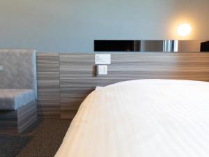 Postel nebo postele na pokoji v ubytování Super Hotel Ishikawa Nomineagari Smart Inter
