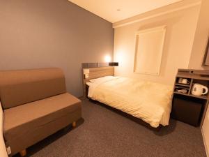 Postel nebo postele na pokoji v ubytování Super Hotel Ishikawa Nomineagari Smart Inter