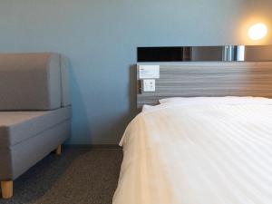Postel nebo postele na pokoji v ubytování Super Hotel Ishikawa Nomineagari Smart Inter