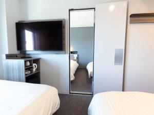 Postel nebo postele na pokoji v ubytování Super Hotel Ishikawa Nomineagari Smart Inter