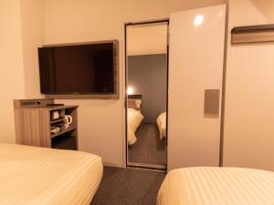 Postel nebo postele na pokoji v ubytování Super Hotel Ishikawa Nomineagari Smart Inter