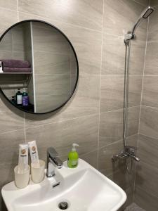 a bathroom with a sink and a mirror at 樂室Room in Nanwan