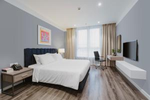 Ένα ή περισσότερα κρεβάτια σε δωμάτιο στο Lexington Westlake +33 φωτογραφίες