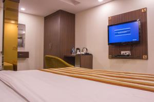 En eller flere senge i et værelse på Hotel Pawan Plaza Near Sir Ganga Ram Hospital
