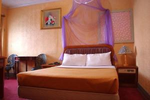Voodi või voodid majutusasutuse Uni Hotel toas