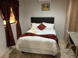 Säng eller sängar i ett rum på Juda Haus Lodge