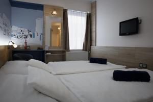 Posteľ alebo postele v izbe v ubytovaní Hotel Irottkö