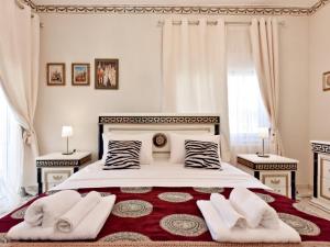 Posteľ alebo postele v izbe v ubytovaní Royal House