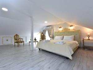 Posteľ alebo postele v izbe v ubytovaní Royal House