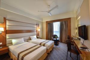 Postel nebo postele na pokoji v ubytování Pearl View Hotel Prai, Penang