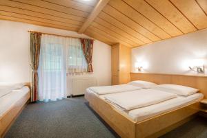 Postel nebo postele na pokoji v ubytování Apartpension Kappacher
