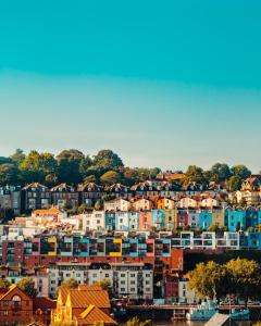 a large city with colorful buildings on a hill at Cosy self-contained studio flat in Bristol in Bristol