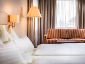 Posteľ alebo postele v izbe v ubytovaní Vergeiner's Hotel Traube