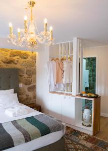 Tempat tidur dalam kamar di Casa da Ana Boutique Guest House