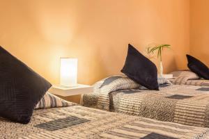 Posteľ alebo postele v izbe v ubytovaní Duplex Pedroza