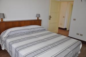 A bed or beds in a room at La Colombera in Toscana