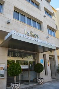 a building with a sign for a boutique hotel at La Sort Boutique Hotel in Moraira