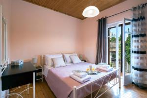 Кровать или кровати в номере Pado's House, Valanio Corfu