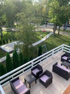 an overhead view of a patio with chairs and tables at Raze in Palanga