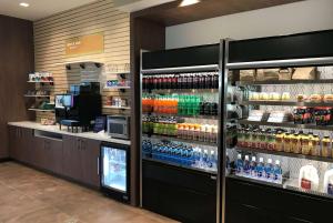 a store with a display case filled with lots of drinks at Wyndham Garden Orlando Universal / I Drive in Orlando