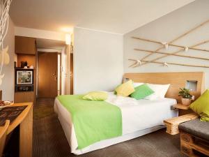 Ένα ή περισσότερα κρεβάτια σε δωμάτιο στο Novotel Gdansk Centrum