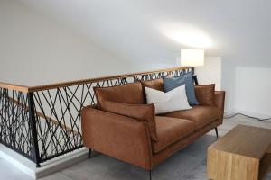 a living room with a couch and a table at La Panadería in El Rompido