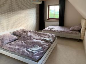 Llit o llits en una habitació de Chalet Jizerky