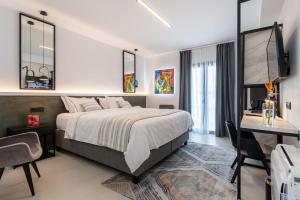Ένα ή περισσότερα κρεβάτια σε δωμάτιο στο Central Boutique Hotel by naoussa hills adults only +33 φωτογραφίες