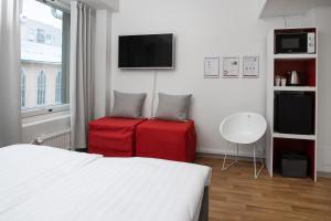 מיטה או מיטות בחדר ב-Omena Hotel Pori