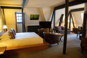a bedroom with a bed and a living room at Hotel du Vin Bristol in Bristol