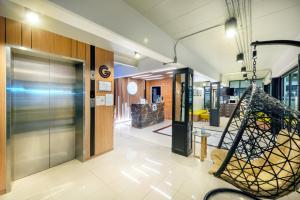 a lobby of a store with a glass door at PLAAI Play Hotel in Rayong