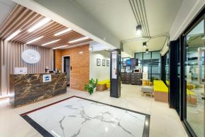 an office lobby with a map on the floor at PLAAI Play Hotel in Rayong