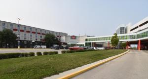 a parking lot with cars parked in a parking lot at Canad Inns Destination Centre Club Regent Casino Hotel in Winnipeg