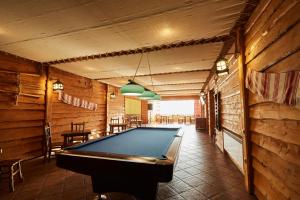 a pool table in the middle of a room at Pansionat Slavskiy in Slavske