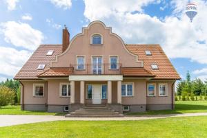 a large house with a cat face on it at Ranczo Kalinka in Wiżajny