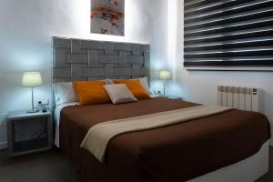 A bed or beds in a room at Apartaments y Habitacions Entre Volcans