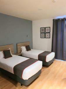 Postel nebo postele na pokoji v ubytování Hospedium Hotel Vittoria Colonna