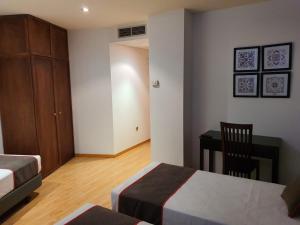 Postel nebo postele na pokoji v ubytování Hospedium Hotel Vittoria Colonna
