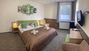 Posteľ alebo postele v izbe v ubytovaní Hotel Dolce Vita