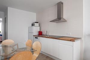 Kuchyňa alebo kuchynka v ubytovaní Apartamentos Wamba