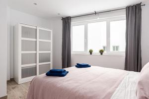 Posteľ alebo postele v izbe v ubytovaní Apartamentos Wamba