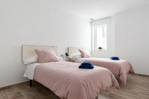 Posteľ alebo postele v izbe v ubytovaní Apartamentos Wamba