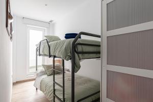 Posteľ alebo postele v izbe v ubytovaní Apartamentos Wamba