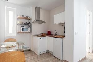 Kuchyňa alebo kuchynka v ubytovaní Apartamentos Wamba