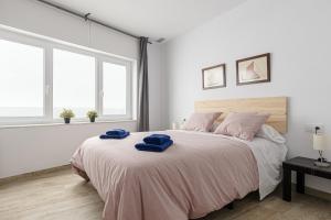 Posteľ alebo postele v izbe v ubytovaní Apartamentos Wamba