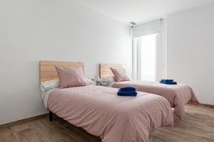 Posteľ alebo postele v izbe v ubytovaní Apartamentos Wamba