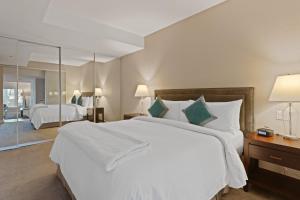 Katil atau katil-katil dalam bilik di SOHO Residences Champagne