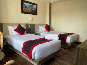 Voodi või voodid majutusasutuse Hotel Wawa toas