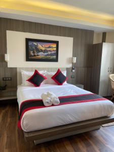 Voodi või voodid majutusasutuse Hotel Wawa toas